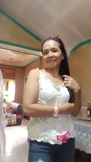 Lolita Jipos, 45, Butuan City, Philippines